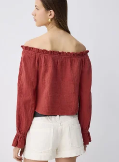 Ruffled off-the-shoulder blouse