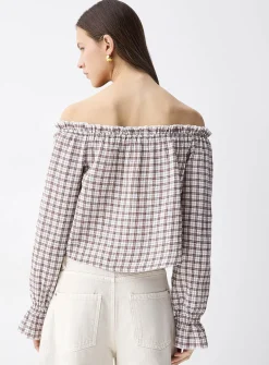 Ruffled off-the-shoulder blouse