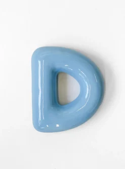 Semiporcelain letter D wall ornament