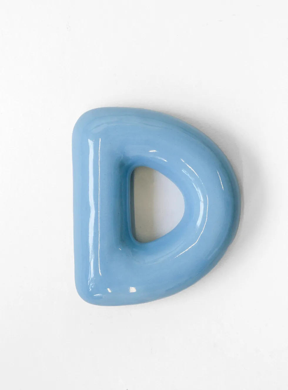 Semiporcelain letter D wall ornament