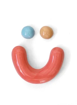 Semiporcelain smiley face wall ornament