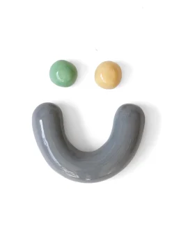 Semiporcelain smiley face wall ornament