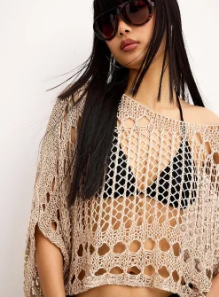 Shimmering openwork poncho