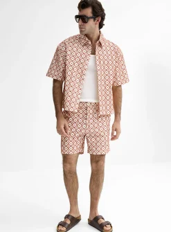 Simple flower embossed jacquard short