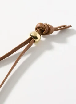 Sinuous medallion cord necklace