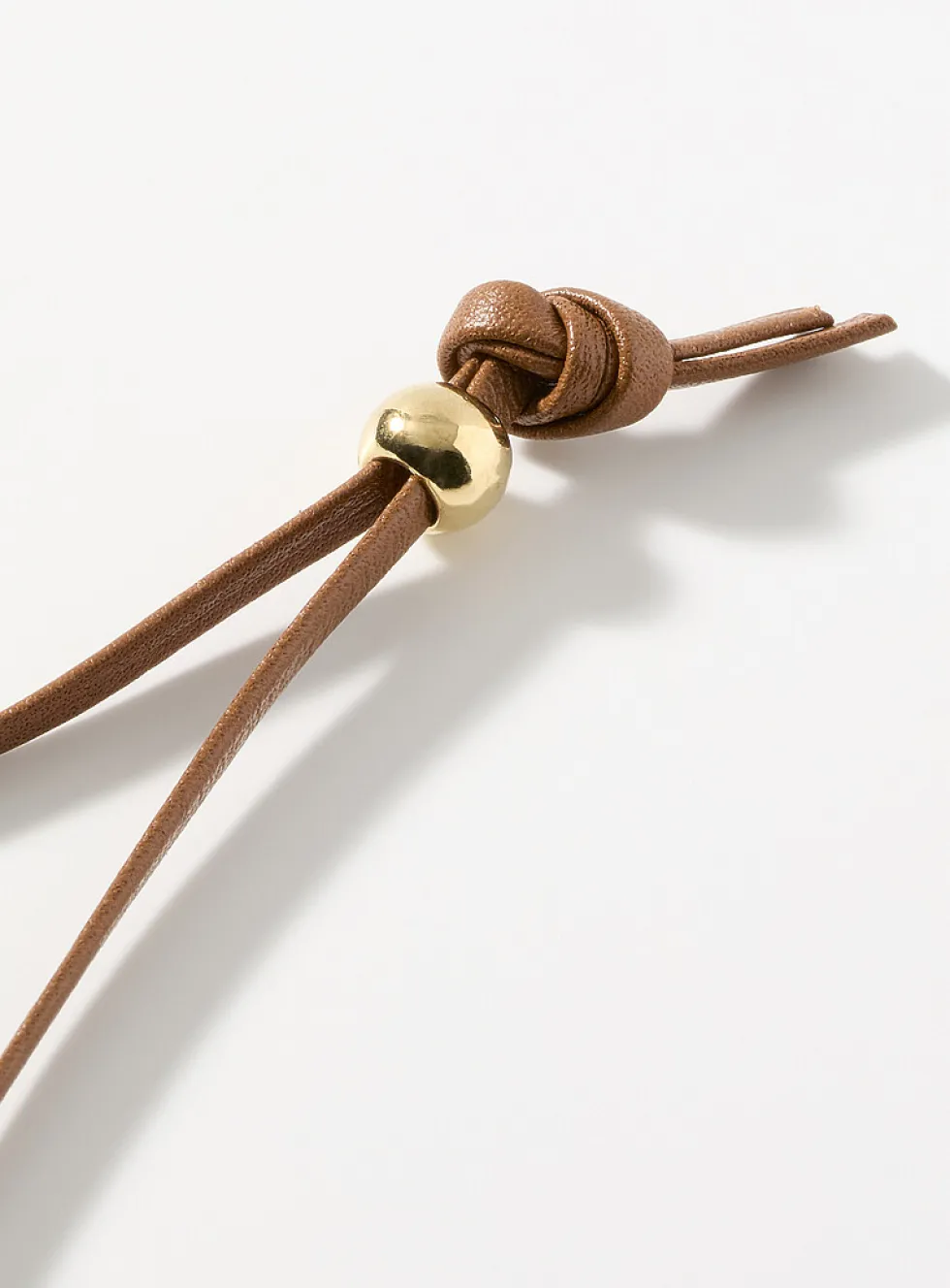 Sinuous medallion cord necklace