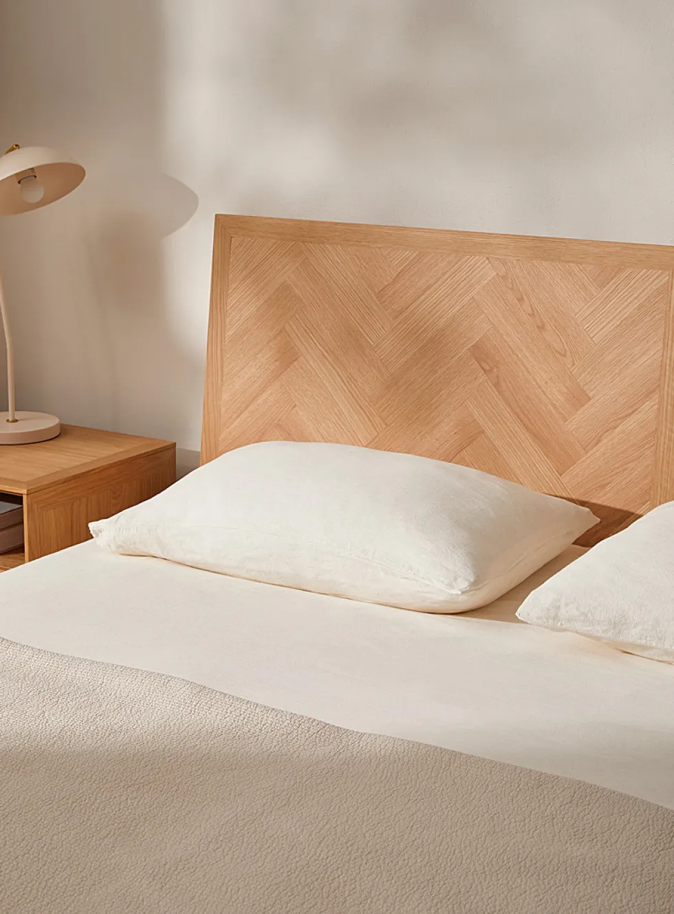 Sleek natural oak bed frame