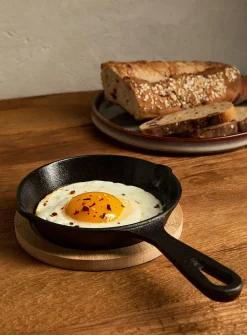Small cast iron skillet with bamboo tray