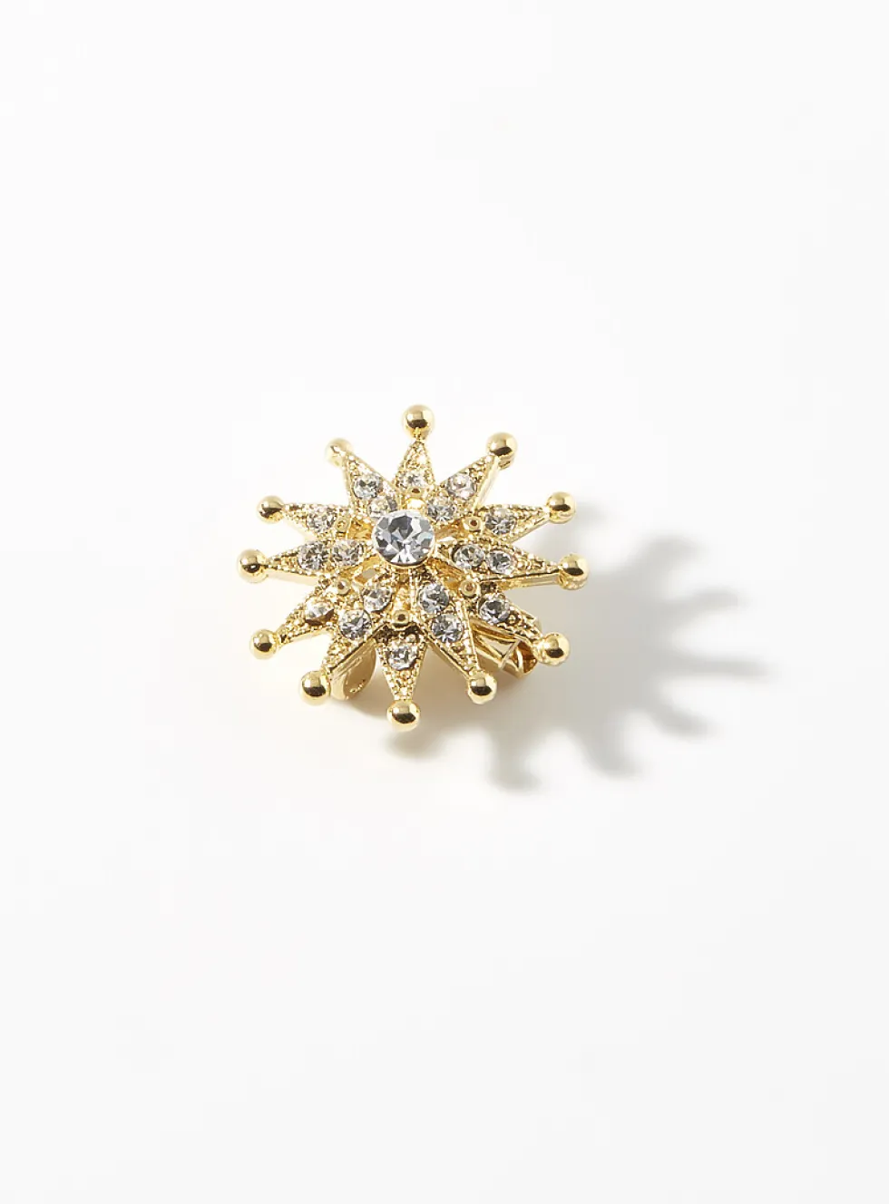 Small golden-star brooch