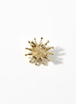 Small golden-star brooch
