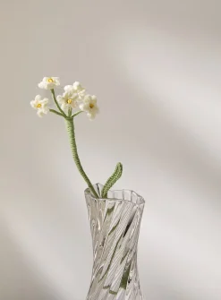 Small white flowers imitation crocheted branch