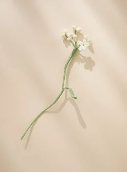 Small white flowers imitation crocheted branch