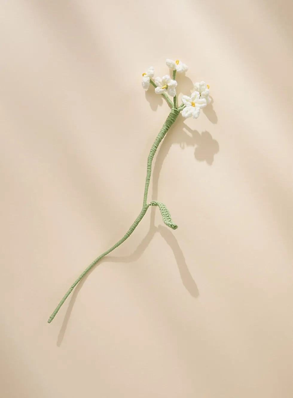 Small white flowers imitation crocheted branch