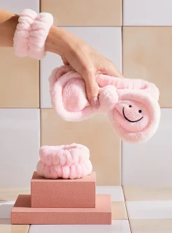 Smiley face bow plush headband
