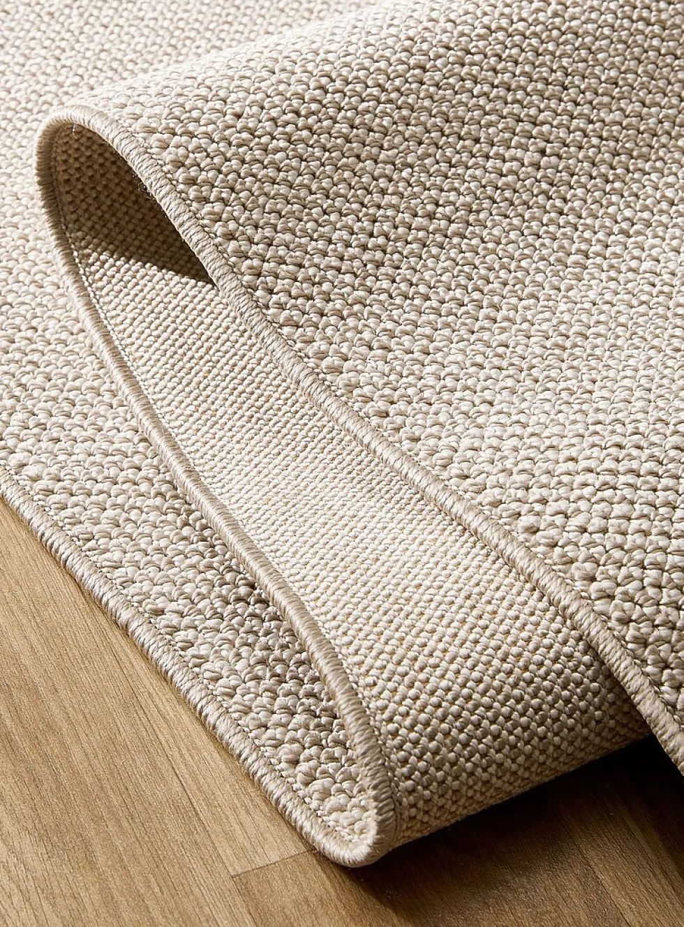 Solid beige bouclé rug