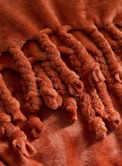 Solid soft plush fringed throw