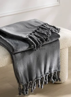 Solid soft plush fringed throw