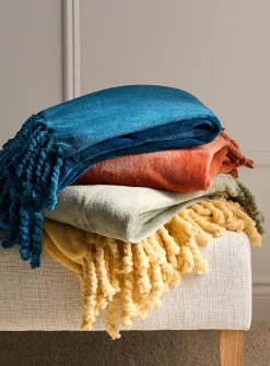 Solid soft plush fringed throw