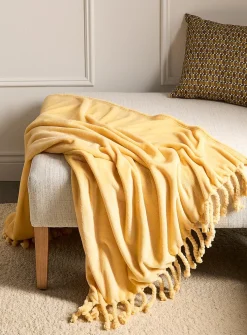 Solid soft plush fringed throw