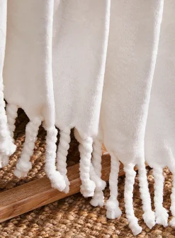 Solid soft plush fringed throw