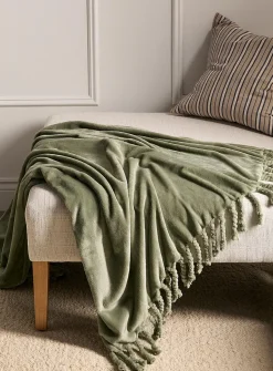 Solid soft plush fringed throw