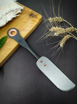 Stainless steel and copper cheese knife