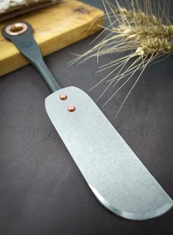 Stainless steel and copper cheese knife