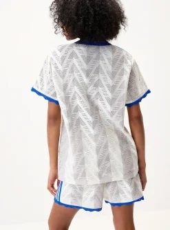 Striped pointelle knit polo shirt
