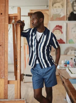 Striped pointelle-knit polo-collar cardigan