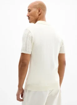 Striped pointelle-knit zip polo