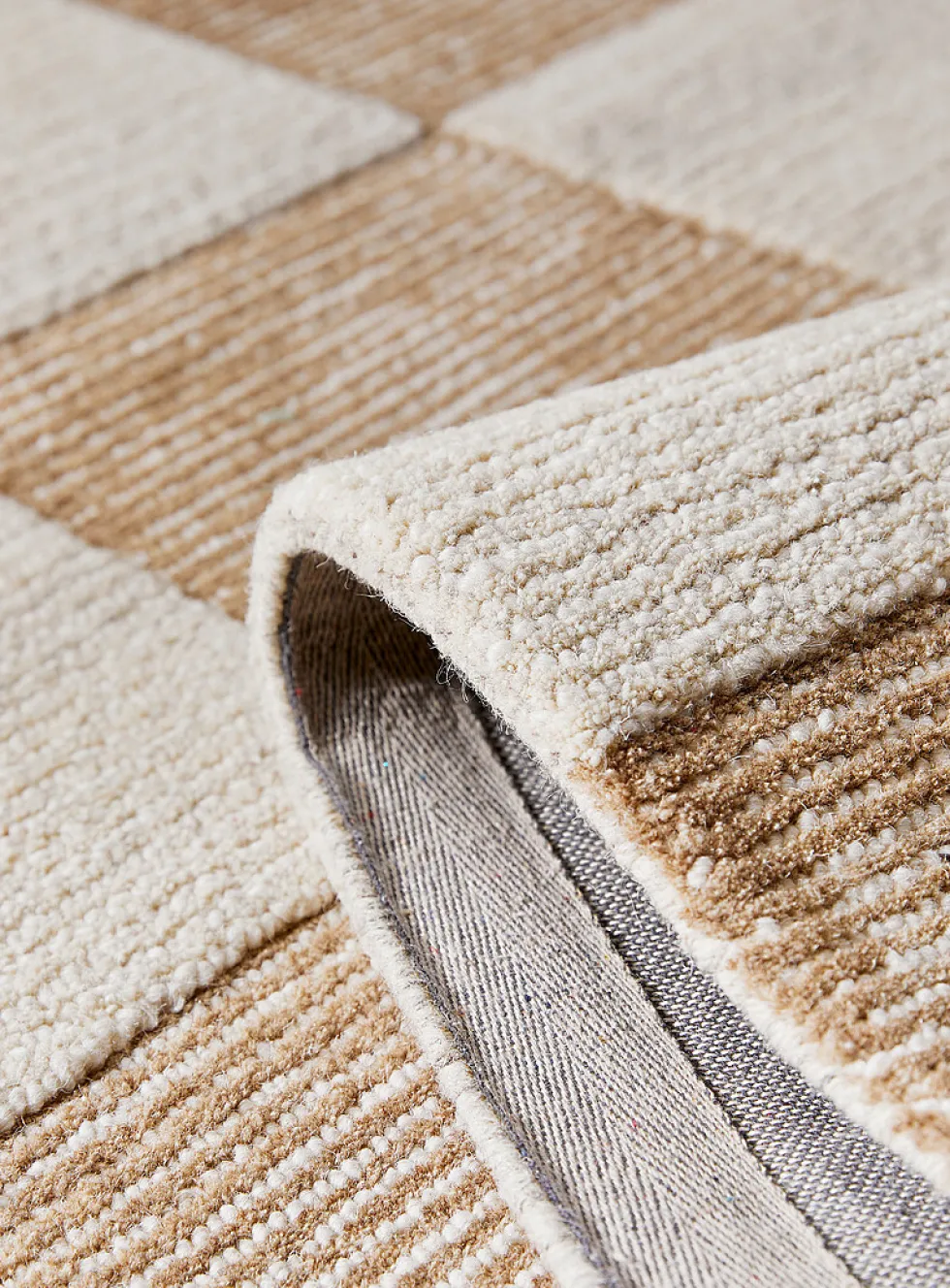 Textured checkerboard artisanal rug