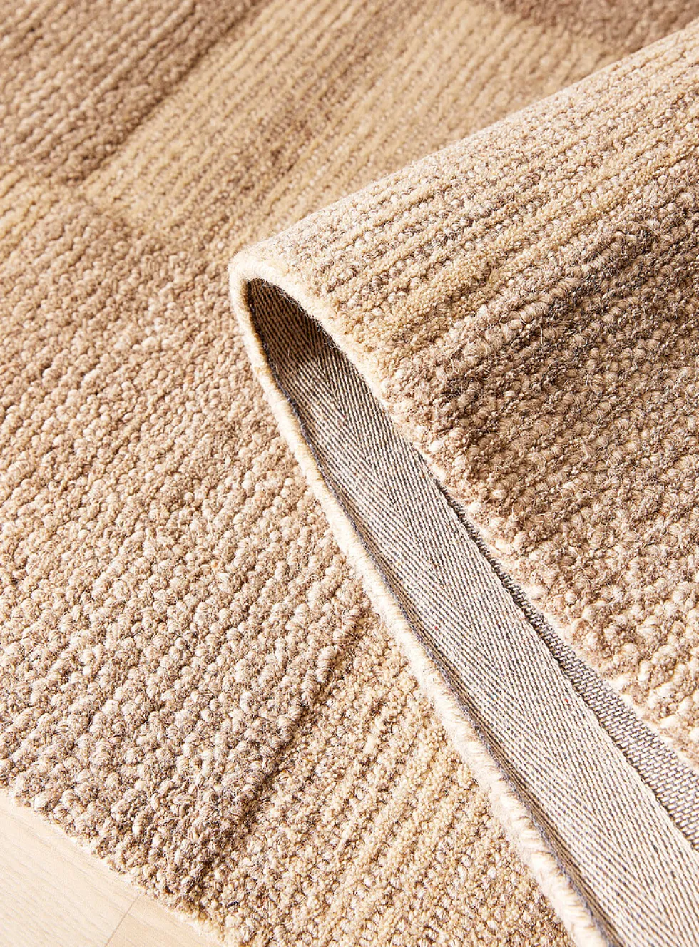 Textured checkerboard artisanal rug