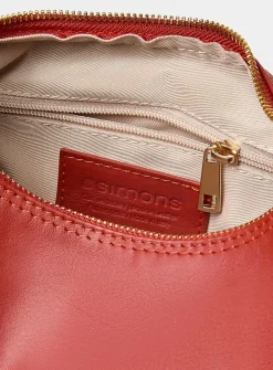 Textured-leather half-moon crossbody bag