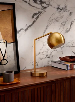 Tilting golden table lamp