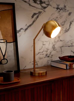 Tilting golden table lamp