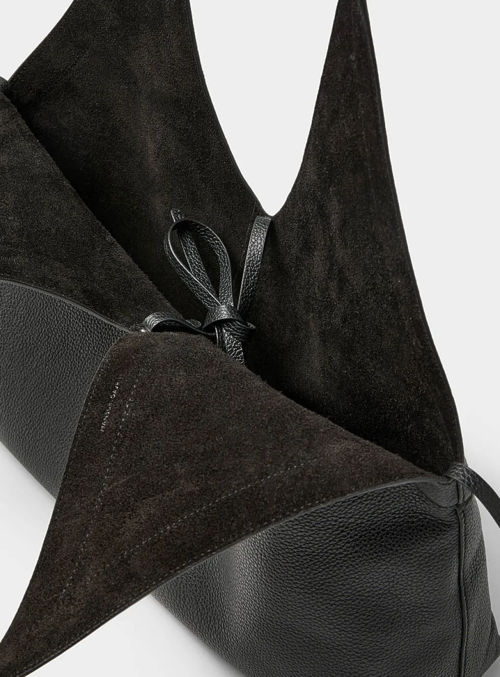 V-shaped cutout supple leather tote bag