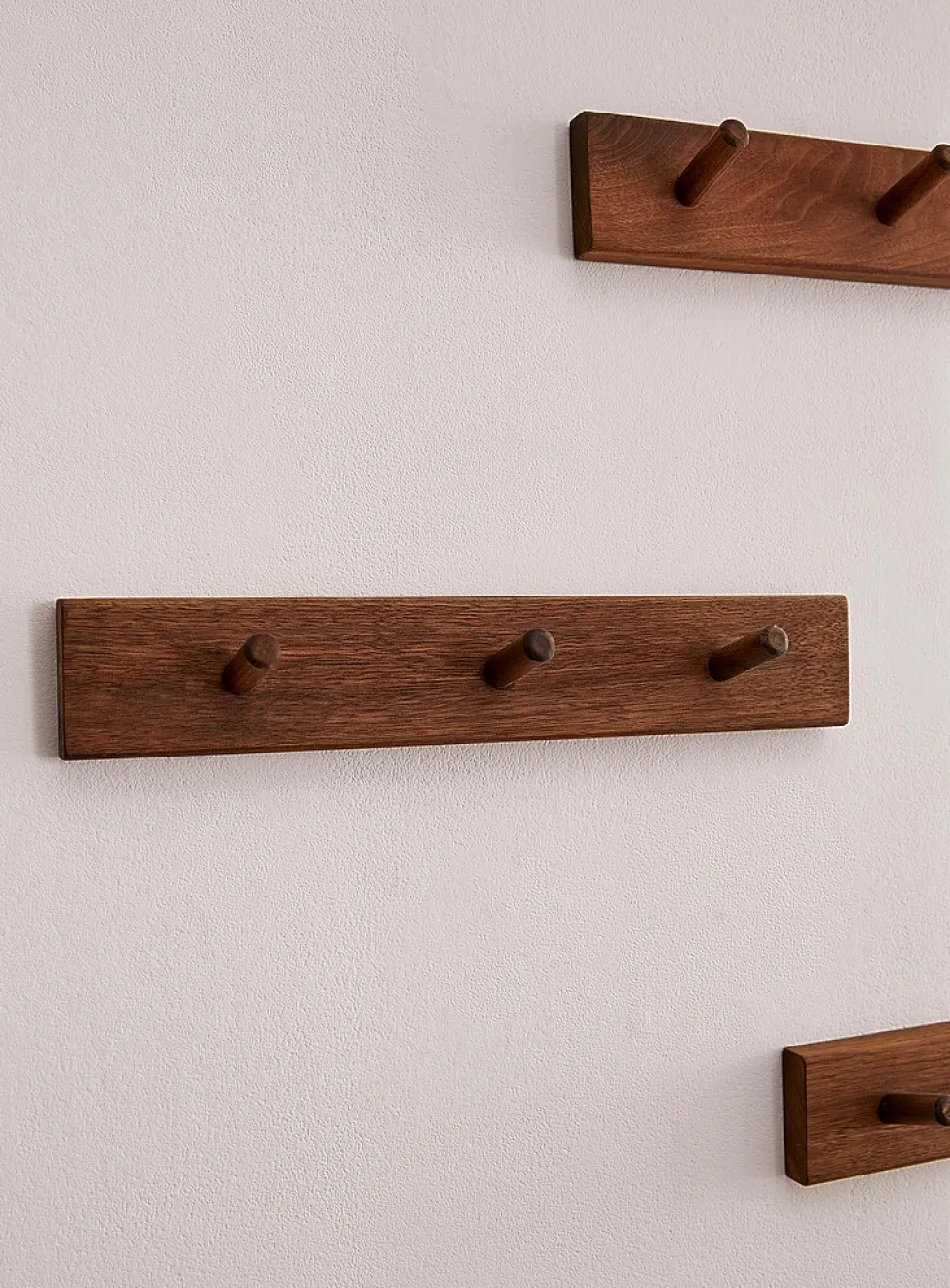 Walnut pegs wall-mounted coat rack