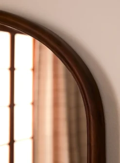 Walnut-finished arched frame mirror
