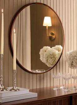 Walnut-finished round frame mirror
