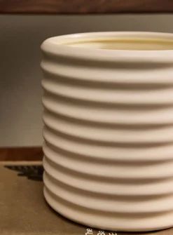 Wavy polished ivory ceramic planter