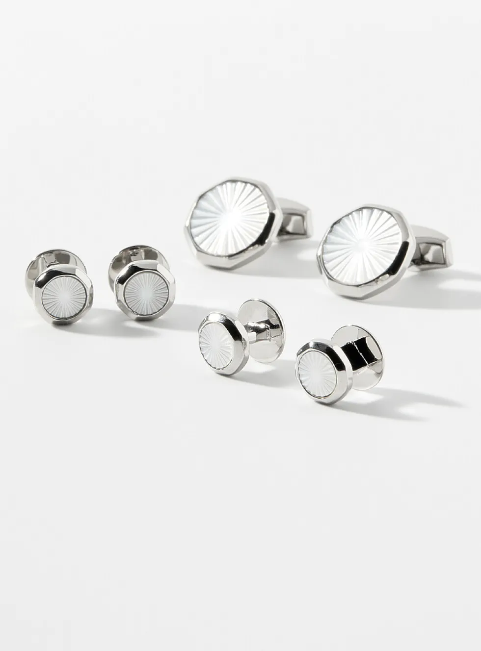 White mother-of-pearl cuff links and shirt buttons