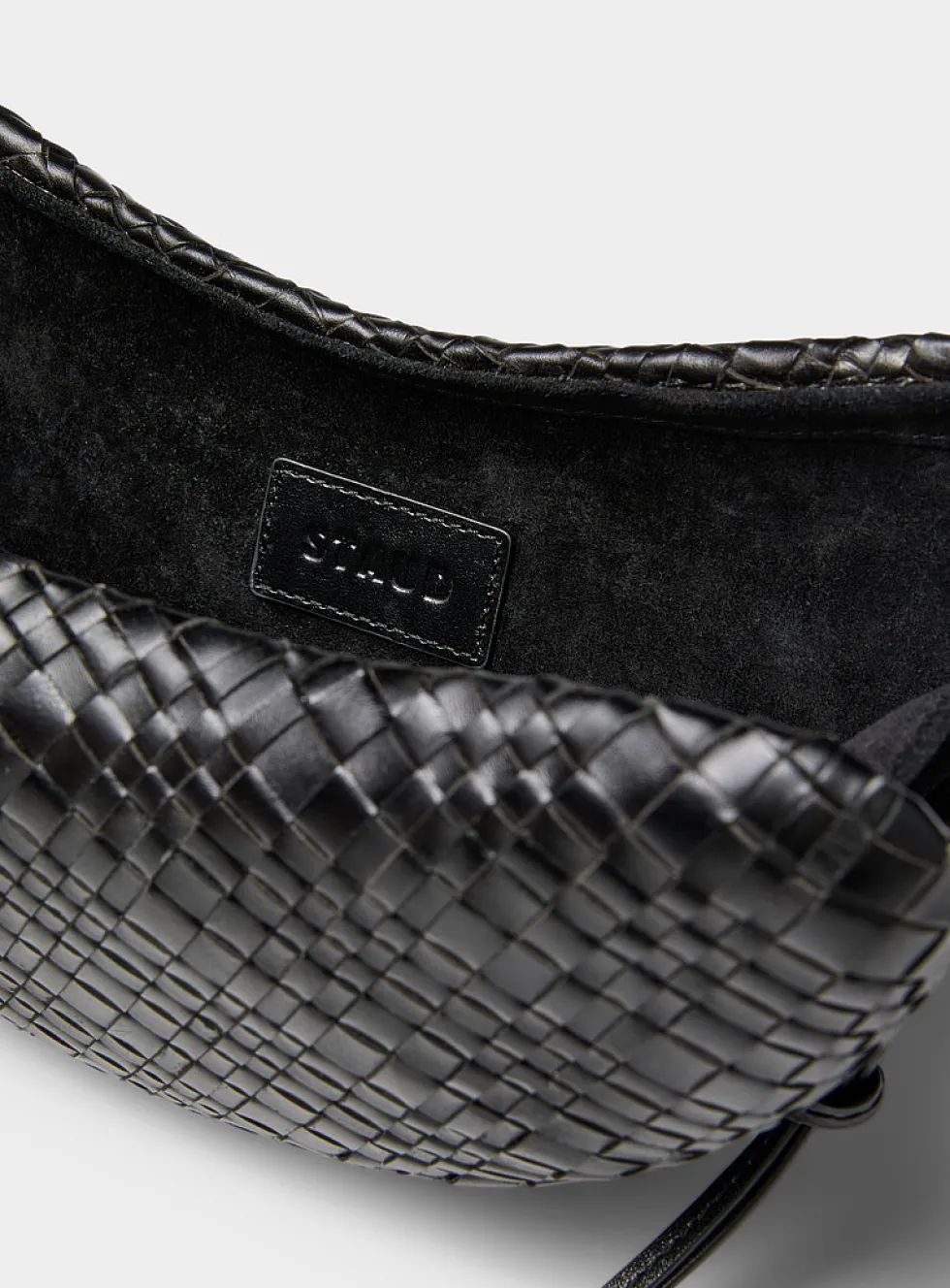 Woven leather crescent clutch