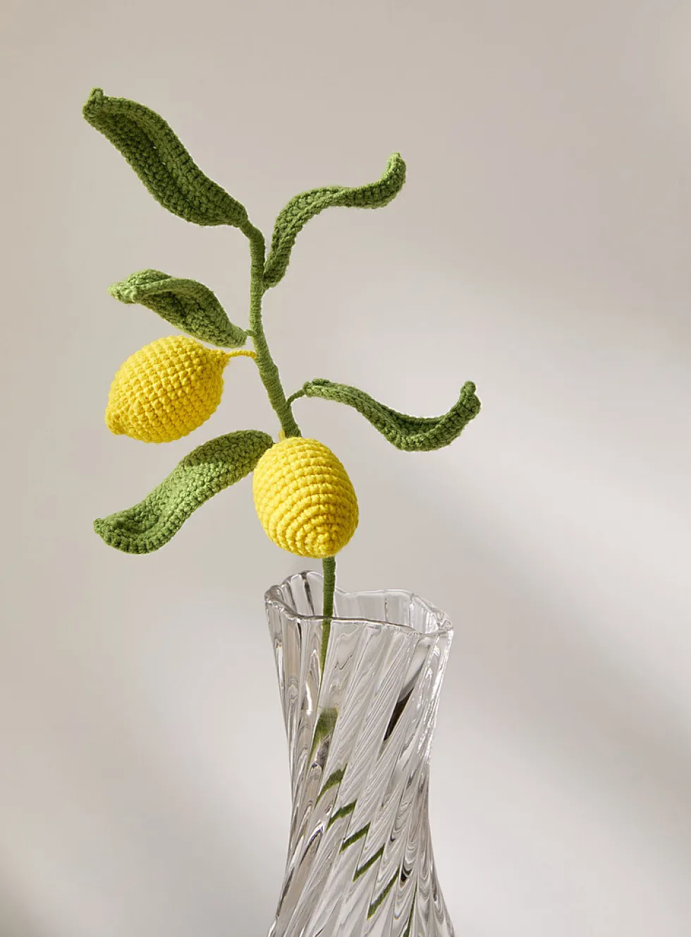 Yellow lemons imitation crocheted branch