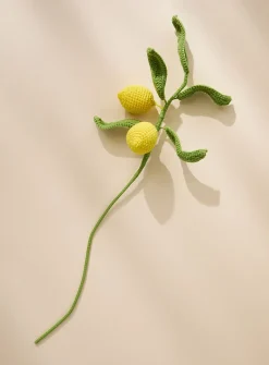 Yellow lemons imitation crocheted branch