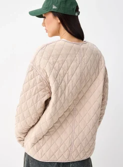 Diamond pattern piped quilted jacket
