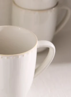 Embossed polka dots white mug