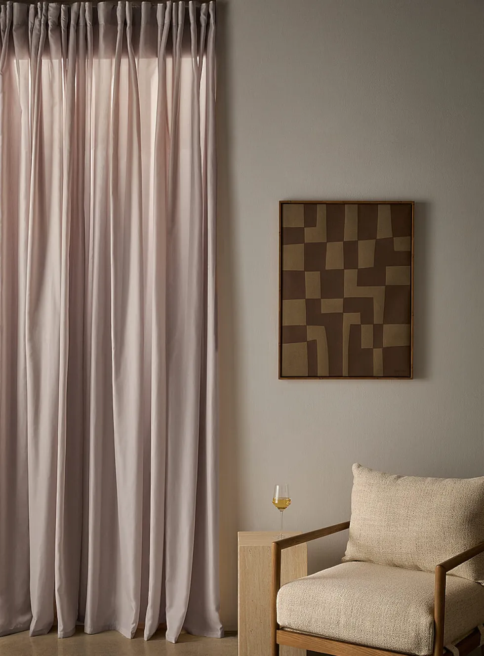 Extra-long neutral-coloured sheer curtain