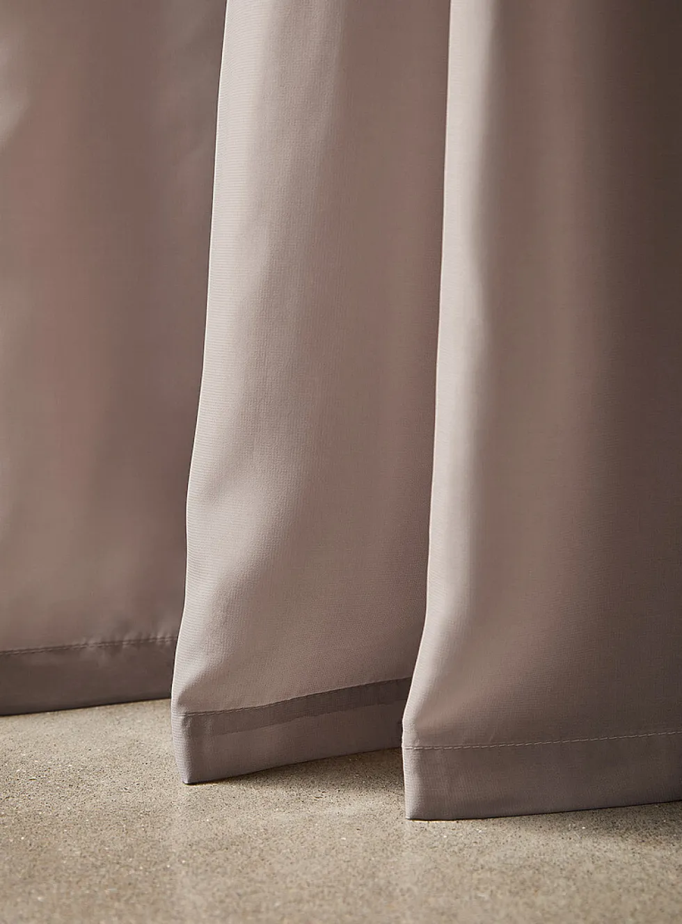 Extra-long neutral-coloured sheer curtain