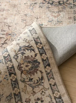Faded floral fresco rug