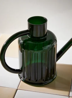 Fluted transparent watering can